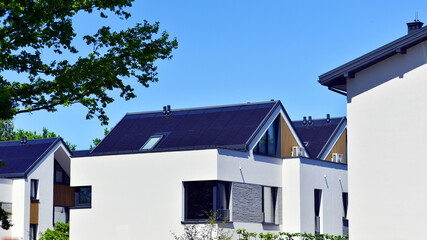 Residential homes with modern facade. Terraced family homes in newly developed housing estate. The...
