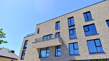 Modern new residential apartment house building complex. Exterior view of modern apartment building. New construction apartment or condo complex.
