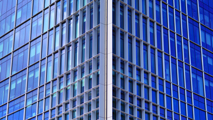 Modern sustainable glass office buildings. Exterior view of corporate headquarters glass buildings architecture.Glass windows in energy-efficient buildings. Financial business center buildings. 