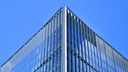 Modern sustainable glass office buildings. Exterior view of corporate headquarters glass buildings architecture.Glass windows in energy-efficient buildings. Financial business center buildings. 