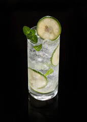 Refreshing Lime and Mint Cooler with Ice on Black Reflective Surface