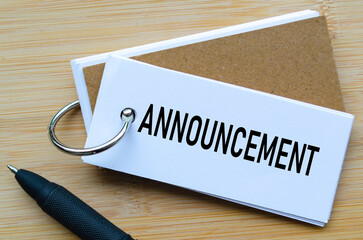 Announcement text on notepad indicating official news or internal communication