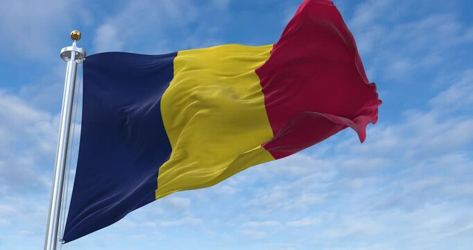 Chad flag with flagpole waving in wind, rolling clouds background looping, 4K video (Perfect Loop)