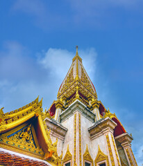 Fototapeta premium The stunning pagoda (Chedi) of the Wat Chalong Temple, housing a relic from the Buddham Phuket, Thailand