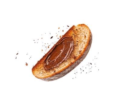 A piece of toasted bread, angled, with chocolate spread, surrounded by scattered specks, possibly cocoa powder or similar