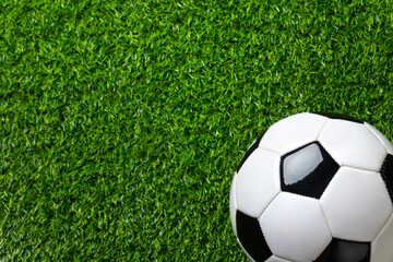 A soccer ball close-up on a green field. High quality photo