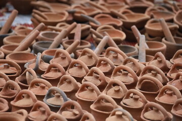 Handmade traditional terracotta clay pots and ceramic earthenware in a market garden in Luang Prabang, Laos