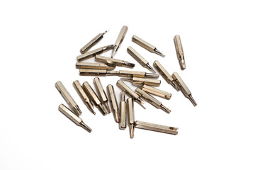Assorted Metal Screwdriver Bits on White Background