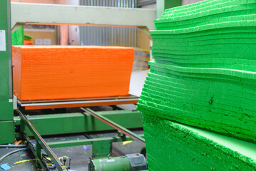 Industrial Foam Cutting of Colored Insulation Sheets in Factory