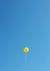 AI-Generated of Minimalist Concept with Negative Space with Yellow Balloon in Blue Sky