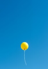 AI-Generated of Minimalist Concept with Negative Space with Yellow Balloon in Blue Sky