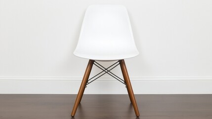 A white chair with wooden legs and backrest.