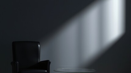 A black leather armchair sits in front of a glass coffee table, bathed in soft light from a window.