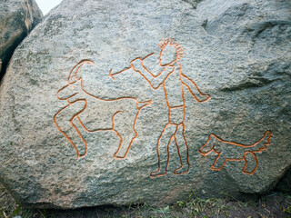 Prehistoric Rock Carving of a Hunting Scene