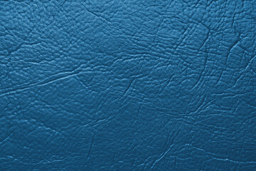 Close up, macro texture of blue glossy natural genuine leather, leatherette structure, artifical skin surface with embossed pattern. Background, wallpaper, backdrop