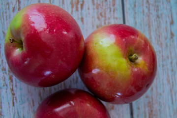 Close-up of juicy apples isolated on a light background – healthy eating and autumn fruits