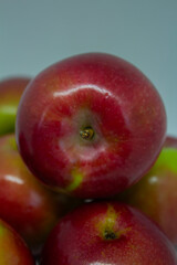 Close-up of juicy apples isolated on a light background – healthy eating and autumn fruits