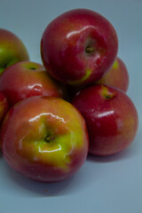 Close-up of juicy apples isolated on a light background – healthy eating and autumn fruits