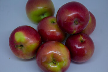 Close-up of juicy apples isolated on a light background – healthy eating and autumn fruits