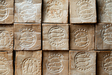 Close up of aged and dry traditional aleppo organic laurel soap bars  as a  background.