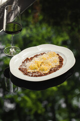 Portion of italian ravioli dumplings with minced beef and wine