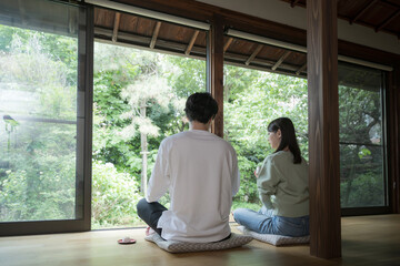 Couple or couple relaxing on the porch Travel image of a ryokan or inn without face