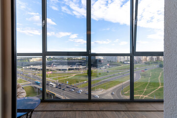 Glazed Balcony Overlooking Urban Intersection