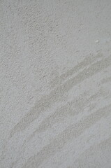 The texture of the white limestone wall, plaster.