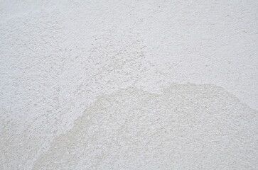 The texture of the white limestone wall, plaster.