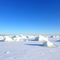Ice hummocks on Lake Bolshoe Krasnoyarsk Krai Siberia Sunny day blue sky white snow azure ice outdoor view of ice blocks at frozen lake in winter