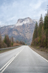 Mountain road and valley of Chuysky Trakt Altai Russia. Scenic route through rugged terrain and expansive natural landscape