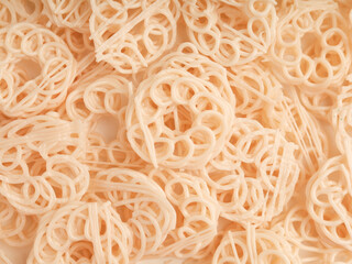 Heap of raw crackers on white background