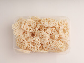 Heap of raw crackers on white background