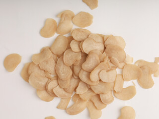 Heap of raw crackers on white background
