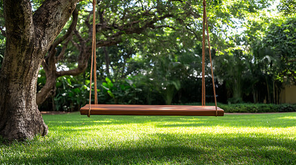 Children's wooden swing set in a sunny garden park with grass and trees