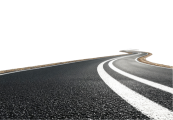 Winding asphalt road disappearing into darkness