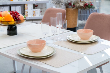 Elegant Dining Table Setting with Fruit and Glassware in showroom