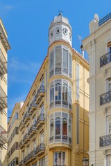 Stunning Corner Building With Ornate Turret And Balconies In Valencia City. Historic architecture, Spanish urban scene, intricate details, blue sky, vibrant facade © ikuday