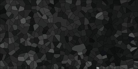 Abstract mosaic pattern of gray and black irregularly shaped polygons with varying shades creating a dark textured background design.