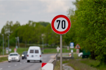 European road speed limit sign, speed limit 70 sign with red circle, red speed warning sign