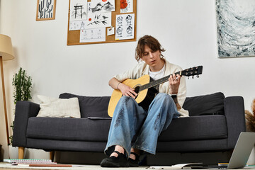 Student enjoying a creative afternoon at home while practicing guitar skills and relaxing