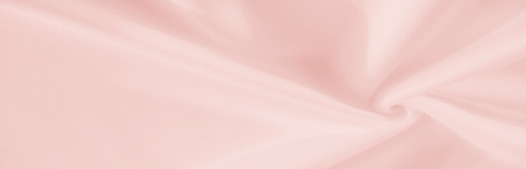 Soft pastel folds create a dreamy swirl of delicate pink fabric, capturing the essence of gentle elegance and inviting a sense of comfort and serenity. An inviting scene of calm