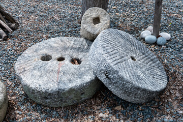 close-up ancient millstone down side	