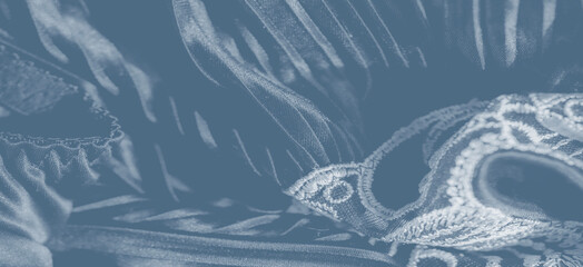 Undulating folds of silk-like fabric create a mesmerizing landscape of cascading pleats, reflecting soft light and adding depth, movement, and a serene sense of fluidity.