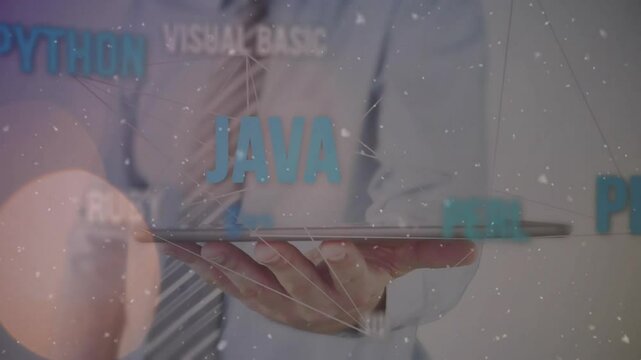 IT specialist tapping tablet screen and generating holographic programming labels in tech demo