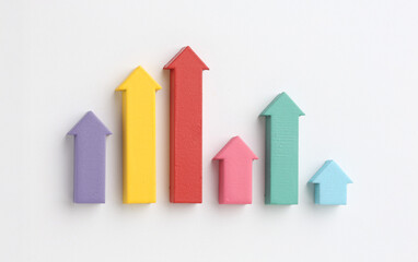 Multicoloured arrows pointing up and down. Symbolise growth progress, success in business finance. Rising bars of graphs represent market trends, return 