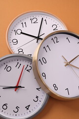 Close-up of a wall clock. The concept of time and work time is valuable for life, Alarm clock stopped. photo in a coloured background