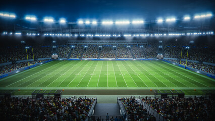Night View of a Massive American Football Stadium From the Sideline. Thousands of Spectators Fill...