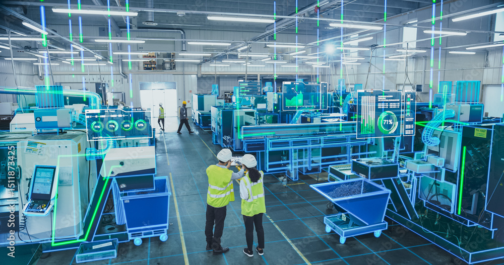 Poster two engineers in safety vests use a tablet to interact with holographic data in a high-tech factory,