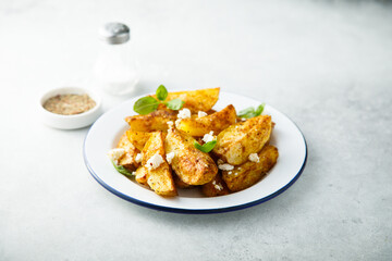 Roasted potato wedges with Feta cheese